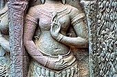 Ta Prohm temple - devatas sculpted on the gallery walls 